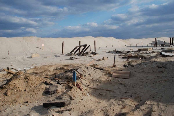 <p>This is all that remains of several oceanfront homes that stood here. During the storm parts of the shattered houses washed across the island into the marina. (Sandy Levine/for NewsWorks)</p>

