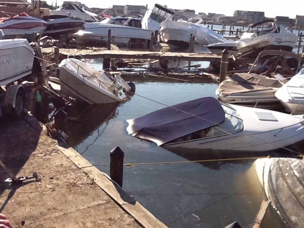 <p><p>After the storm the marina was littered with damaged boats resting on top of debris from oceanfront homes that washed across the island. (Photo courtesy of Jimmy Ryan)</p></p>
