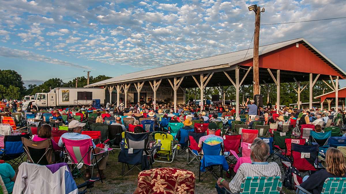  It's a very relaxed atmosphere at the DelVal Bluegrass Festival. You are welcome to sit in any chair until the owner comes back. (Howard Pitkow/for Newsworks, 2016 file photo) 