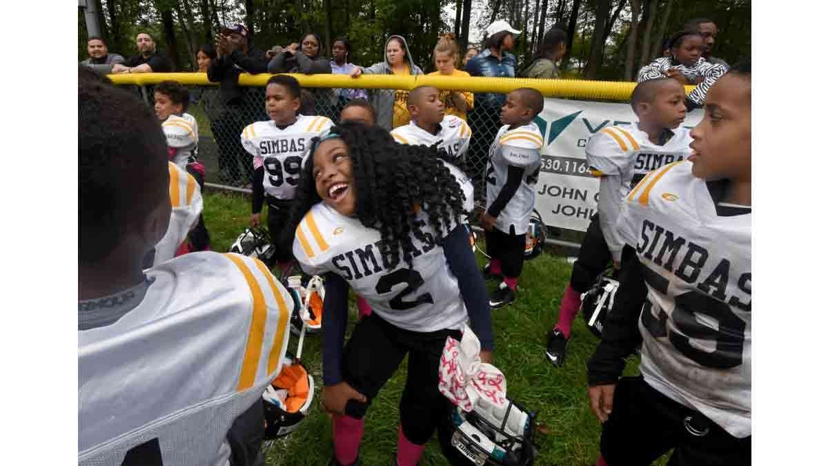On the sidelines of a Simbas game in Howell, N.J., Janiyah Hill lets down her hair.