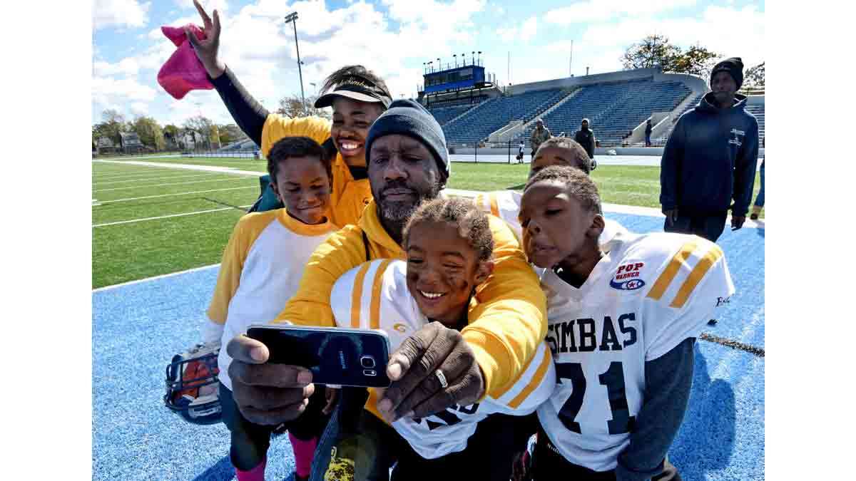 After the last game in Asbury Park, coaches Deneen Roundtree and Orlando Council-Pettigrew take a selfie with players from left to right: Caleb Johnson; Ion Townsend; and Timil Moore.
