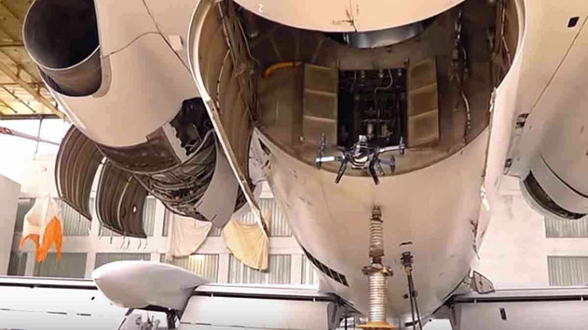 The Luftonix drone is shown inspecting an interior compartment of the plane.