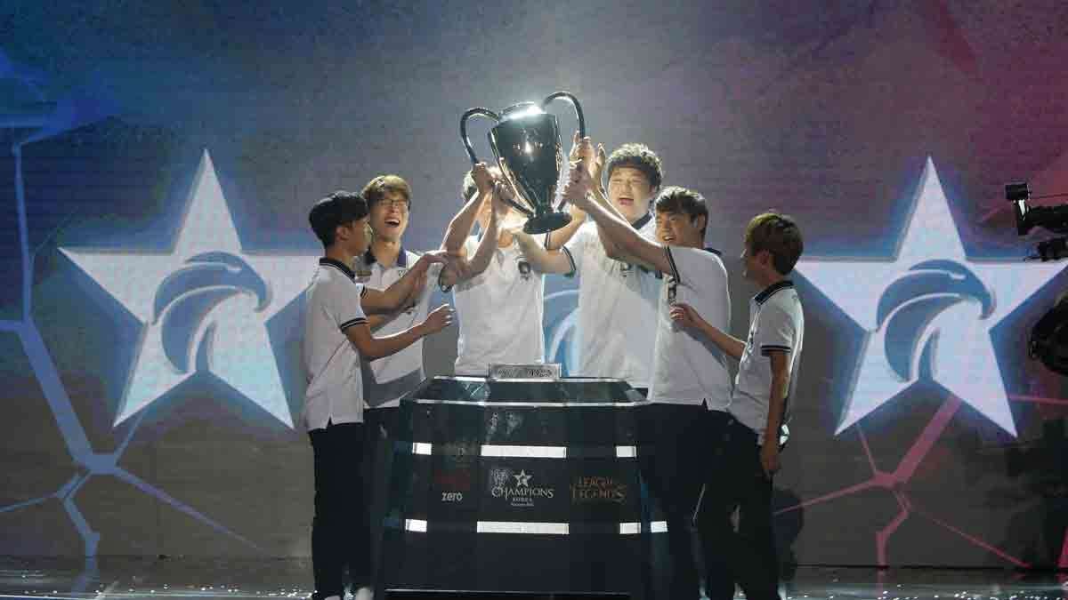 In this Aug. 20, 2016, photo, professional players of Rox Tigers hold up the trophy after winning the 2016 Coca-Cola League of Legend Summer Final in Seoul, South Korea.