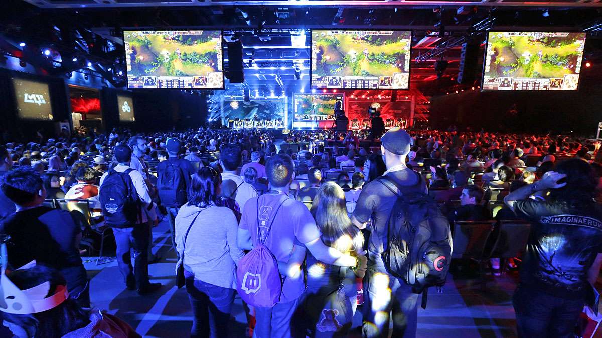 In Seattle hundreds of spectators filled an exhibition hall to watch a round of the League of Legends championship series video game competition, Friday, Aug. 29, 2014, at the Penny Arcade Expo, which attracted nearly 85,000.