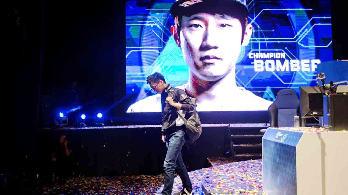 In this July 13, 2014 photo, Choi 'PoLt' Seong Hun steps off the stage after losing the championship game to Choi 'Bomber' Ji Sung, both of South Korea, in Atlanta.