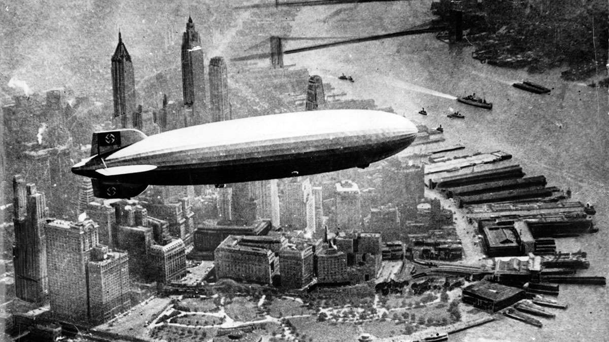 German airship 'Hindenburg' photographed from a plane, is seen flying over Manhattan Island, New York, USA in the 1930s.