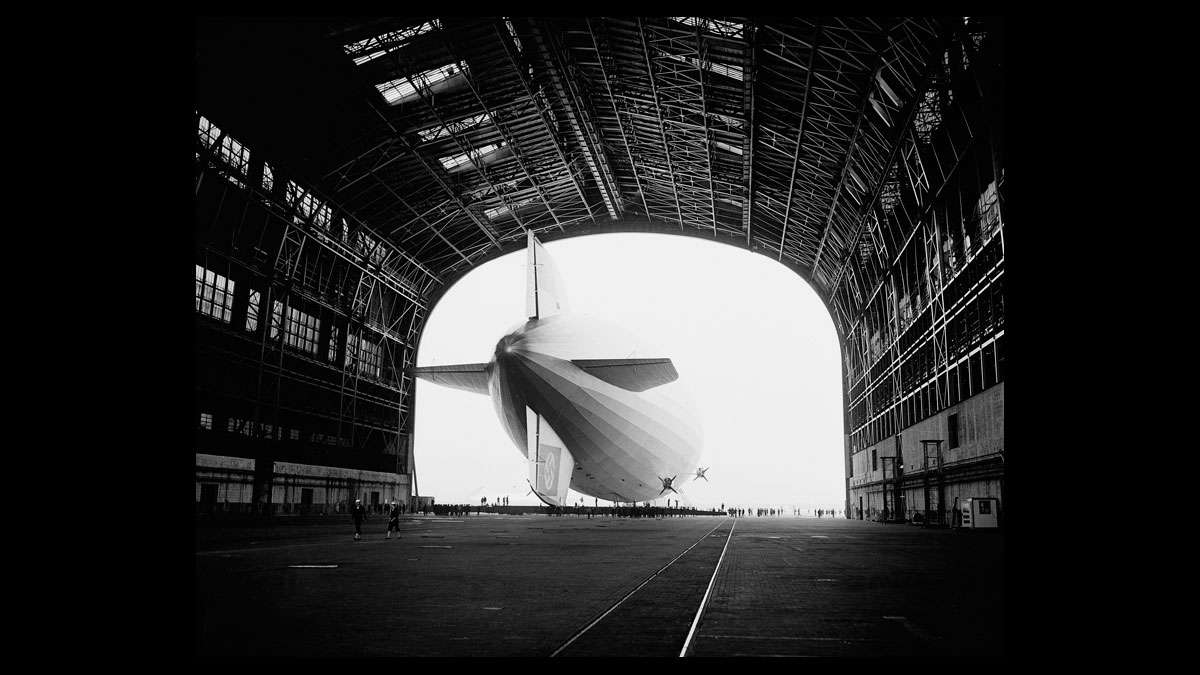 The German-built zeppelin Hindenburg is shown from behind, with the Swastika symbol on its tail wing, as the dirigible is partially enclosed by its hangar at the U.S. Navy Air Station in Lakehurst, N.J., May 9, 1936.