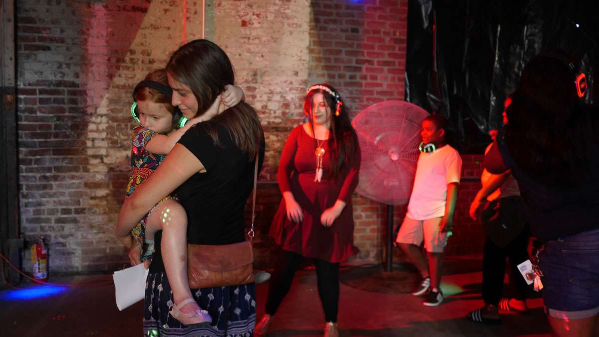 One room that is purposely kept dark was used for the silent disco at Art All Night in Trenton. (Alan Tu/WHYY)