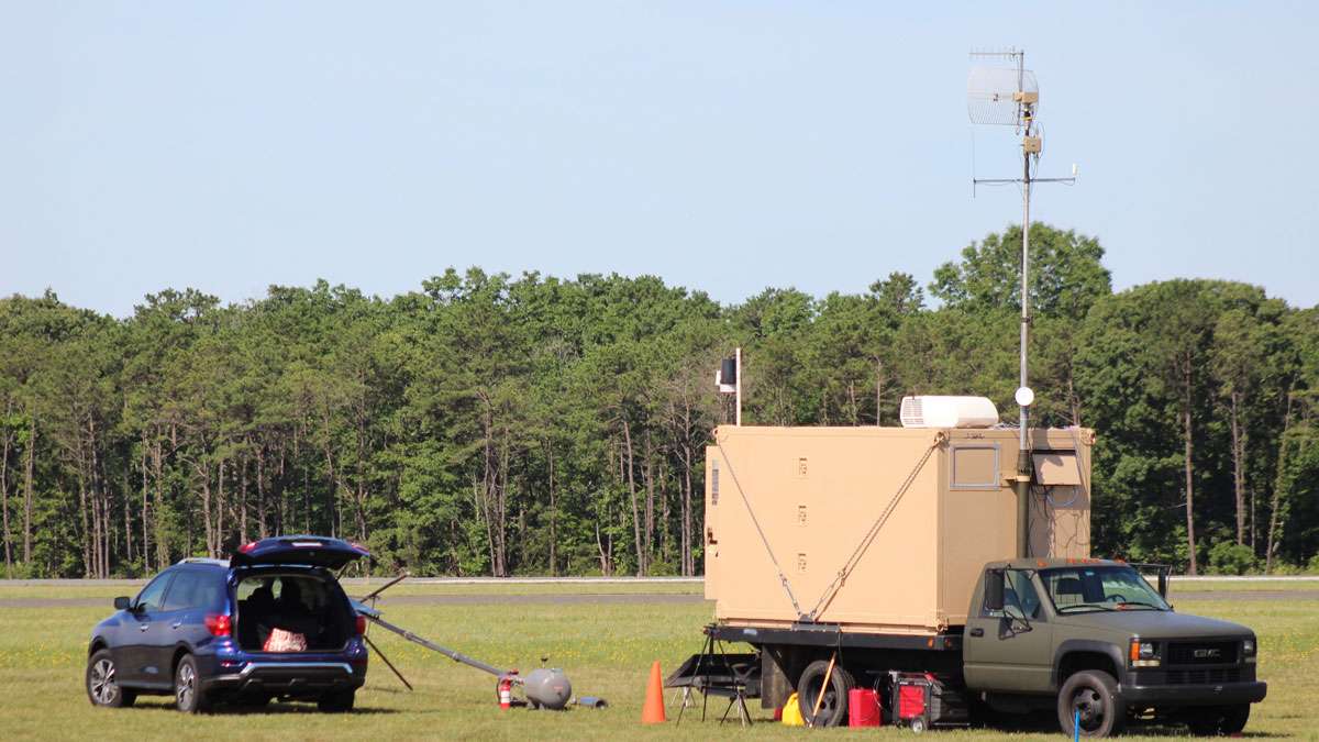 A mobile command vehicle is parked where the drone was launched in Woodbine, N.J.