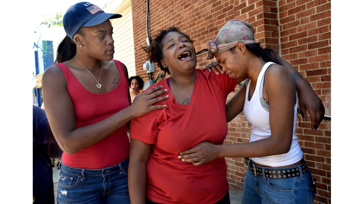 On July 31, Elisha Williams, who lost daughter Laiyannie Williams, 4, in the family's house fire on Morton Street, cries; at right is her sister, Jamillah Williams.