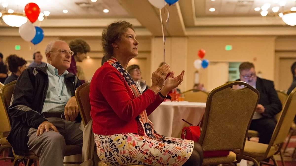 Meg Leister of Emmaus, Pennsylvania, applauds as Republican presidential candidate Donald Trump pulls ahead of Democratic candidate Hilary Clinton during a watch party for U.S. Senator Pat Toomey. (Lindsay Lazarski/WHYY)