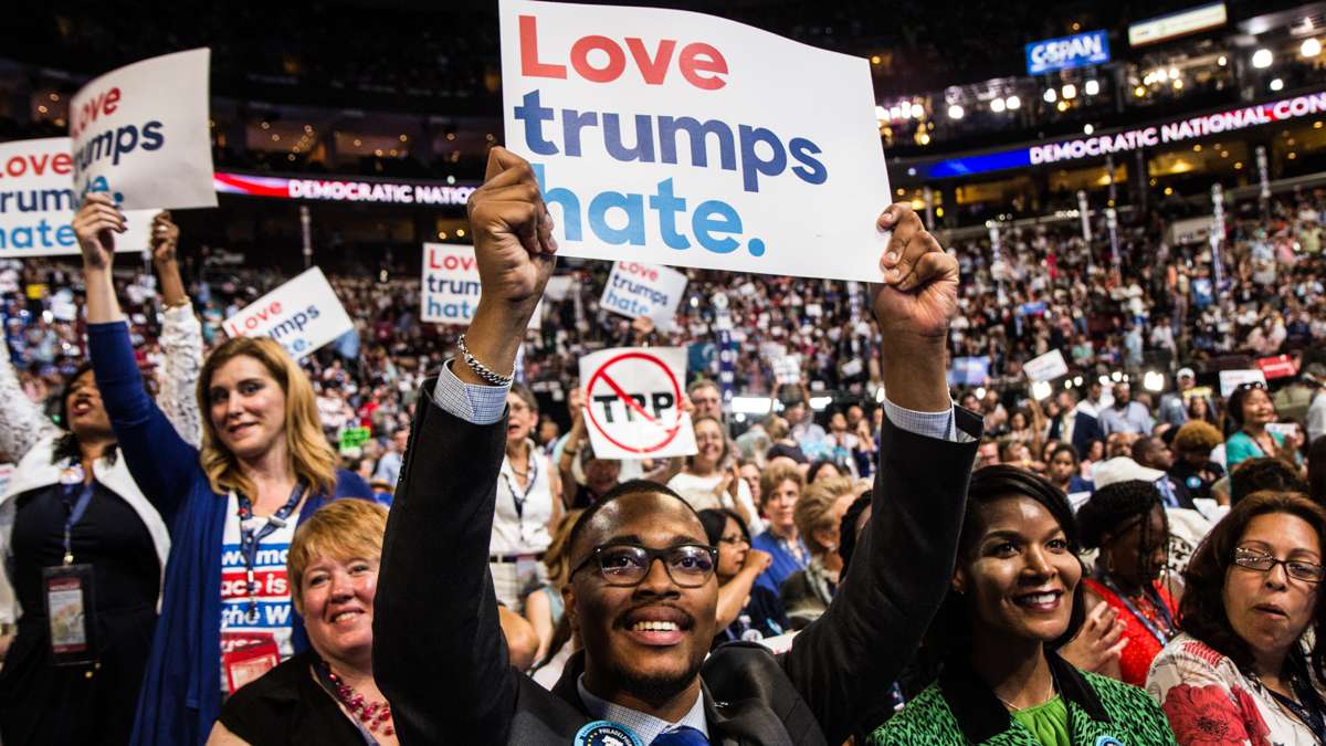 Clinton Delegate Malcolm Kenyatta cheers during the first night of the Democratic National Convention in Philadelphia. (Kimberly Paynter/WHYY)