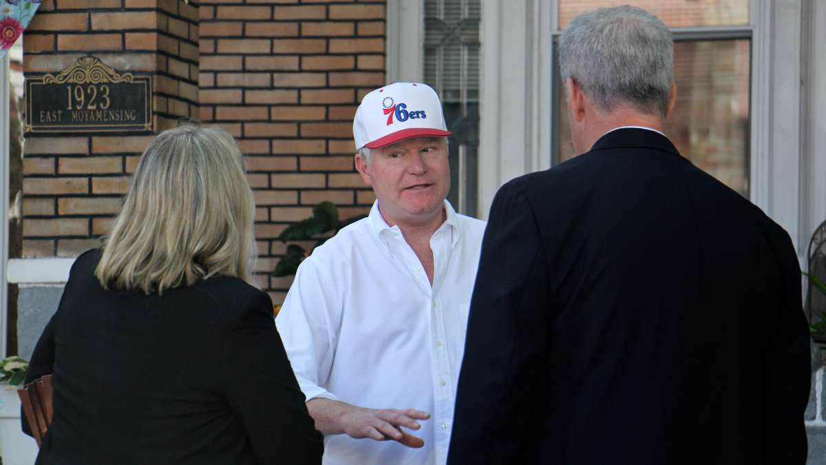 John ''Johnny Doc'' Dougherty talks with law enforcement agents after his South Philadelphia home was raided by the FBI. (Emma Lee/WHYY)