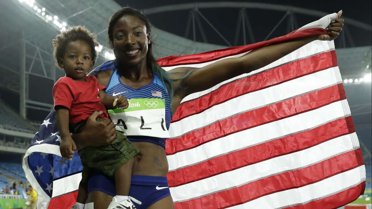 Philadelphia native Nia Ali wins the silver medal in the 100-meter hurdles at the 2016 Summer Olympics in Rio de Janeiro. She poses with her 15-month-old son Titus Wednesday, Aug. 17, 2016. (AP Photo/Matt Dunham) 