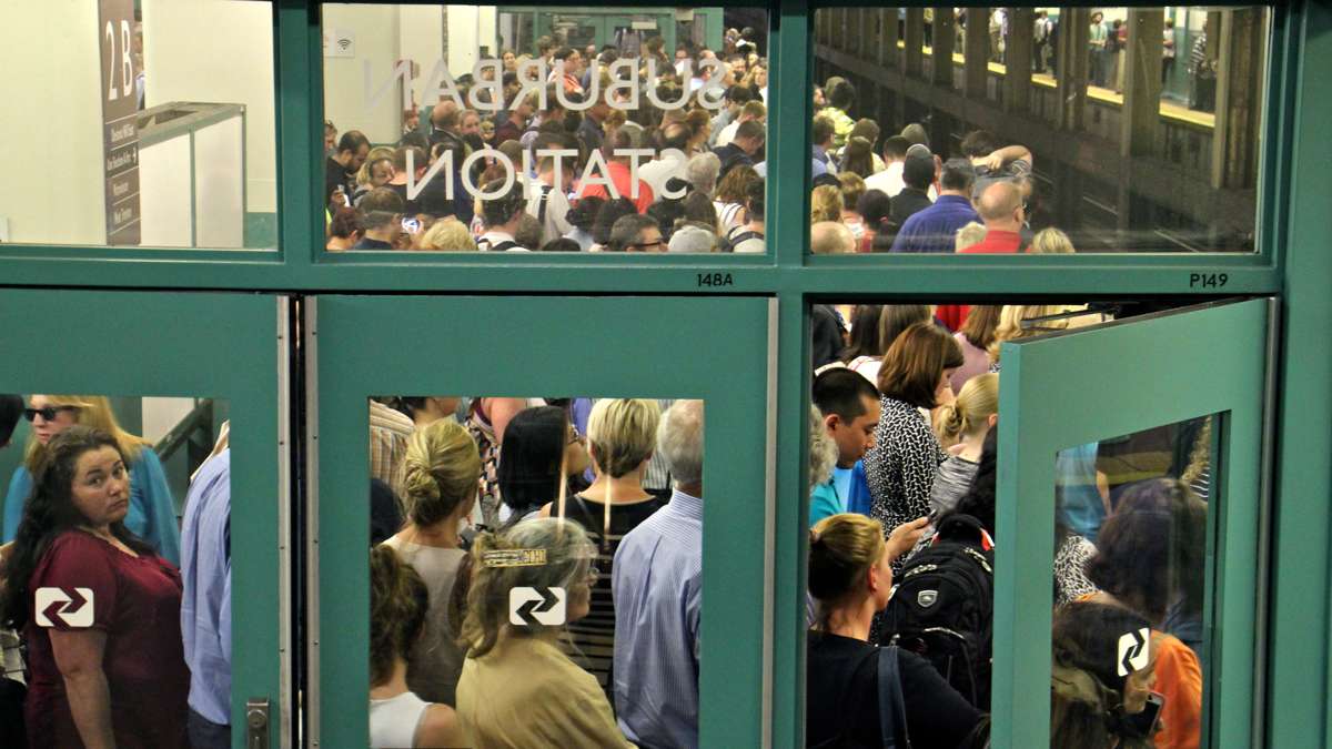 Regional rail passengers pack the platforms at Suburban Station at rush hour on July 5, 2016, after structural defects were found in Silverliner V railcars. Rail commuters' woes returned in November when a strike shut down the city's subway, bus, and trolley system. (Emma Lee/WHYY)