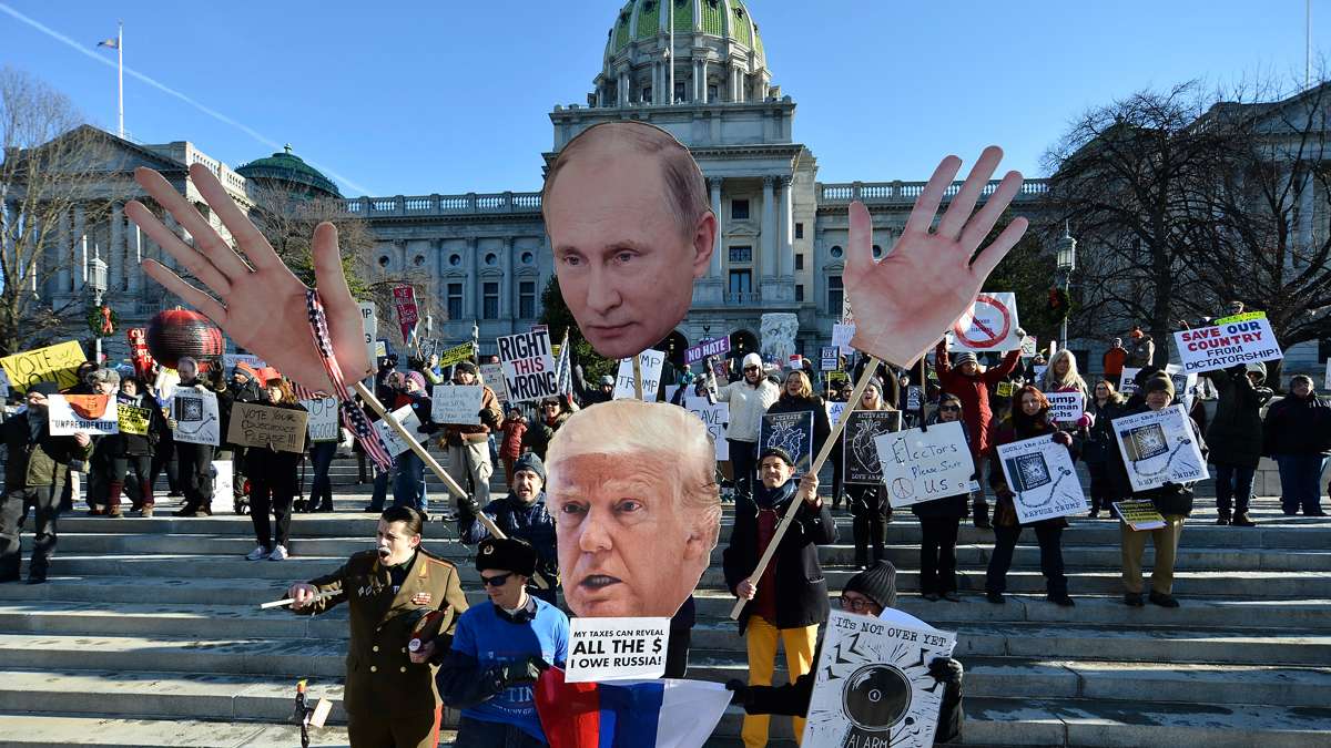 While Pennsylvania electors cast their ballots for Donald Trump on Dec. 19, 2016, protesters gather outside the capital in Harrisburg. (Bastiaan Slabbers for NewsWorks)