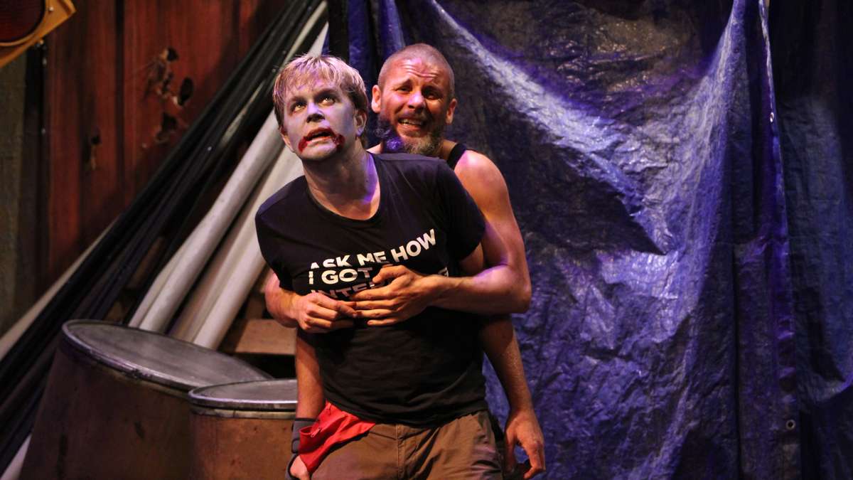 On stage, Zombie Peter refuses to be subdued by Lane, portrayed by Terry Brennan. (Emma Lee/WHYY)