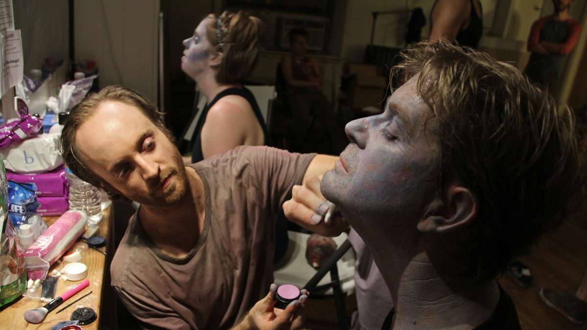 Kyle Yackoski adds the finishing touches to Peter Crimmins' zombie makeup. (Emma Lee/WHYY)