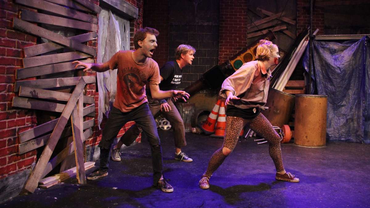 Under the guidance of Zachary Chiero and Tara Demmy, WHYY's Peter Crimmins (center) learns how to act like a zombie. (Emma Lee/WHYY)