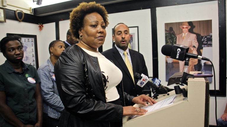 Rochelle Bilal (center), president of the Guardian Civic League, and Brian Mildenberg (right) attorney for a group of African American police officers, level charges of racism against the leadership at the Philadelphia narcotics unit. (