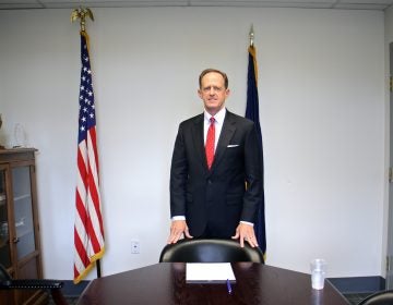  U.S. Sen. Pat Toomey stands in a conference room at his Philadelphia office. (Emma Lee/WHYY) 