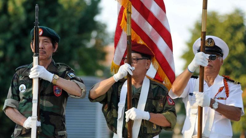 Representatives of the South Vietnamese community and students from Franklin High School Junior R.O.T.C. take part in the POW/MIA ceremony at Philadelphia Vietnam Veterans Memorial on Friday.