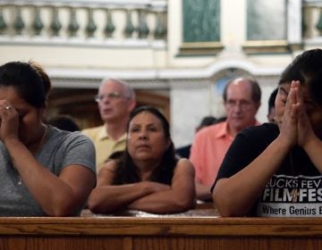 About 250 people gathered at St. Patrick's Church in Norristown, Pa. to pray for victims of this week's earthquake in Mexico and Hurricane Maria in Puerto Rico. (Bas Slabbers/for NewsWorks)