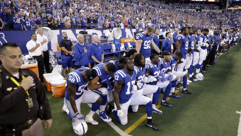 Members of the Indianapolis Colts take a knee during the Nation Anthem before an NFL football game against the Cleveland Browns in Indianapolis, Sunday, Sept. 24, 2017. (AP Photo/Darron Cummings)