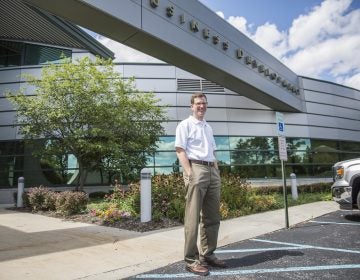 Steven McKnight in front of the building that houses the Altoona Blair County Development Corp., where he's the president and CEO. He started the First Frontier campaign to bring natives and newcomers to Altoona. (MIN XIAN / WPSU)