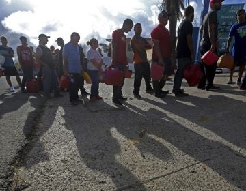 People wait in line for gas, in the aftermath of Hurricane Maria, in Aibonito, Puerto Rico, Monday, Sept. 25, 2017.