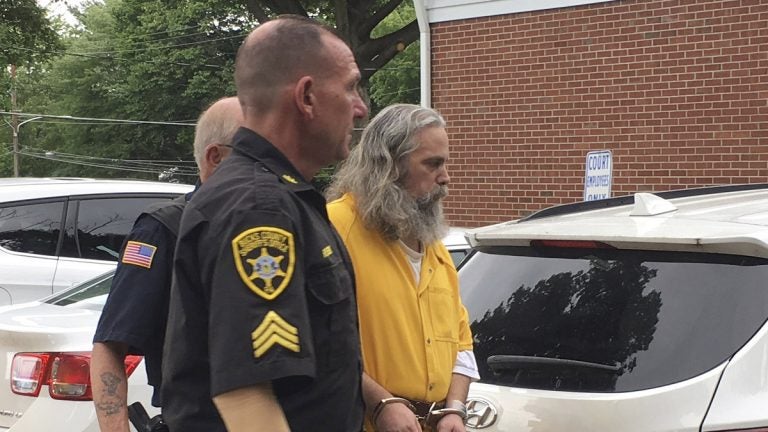 Lee Kaplan is led to a preliminary hearing last year outside Bucks County Magisterial District Judge John I. Waltman's courtroom in Feasterville, Pennsylvania. Kaplan was sentenced Wednesday to decades in prison for sexually abusing six young sisters.(AP Photo/Megan Trimble)