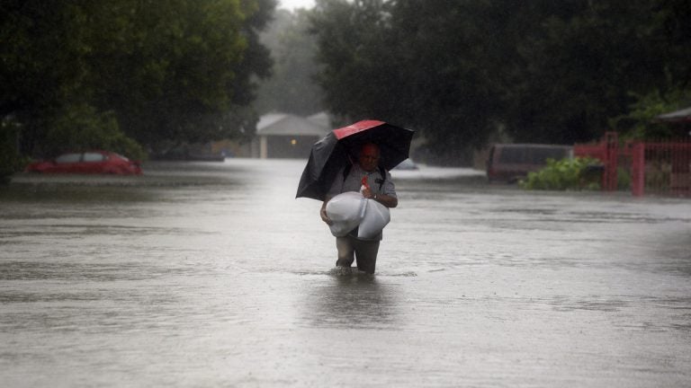  Eldemiro Chavaria walks in floodwaters from Tropical Storm Harvey as he leaves his neighborhood in Houston, Texas, Monday. Forecasters are evaluating whether New Jersey will be n the path of a hurricane this season.(AP Photo/LM Otero) 