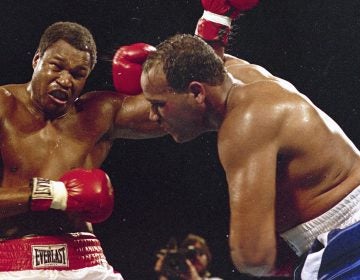 In March 1985, Larry Holmes, left, battles David Bey during a bout in Las Vegas. Bey, a former heavyweight boxing champ from Philadelphia nicknamed 