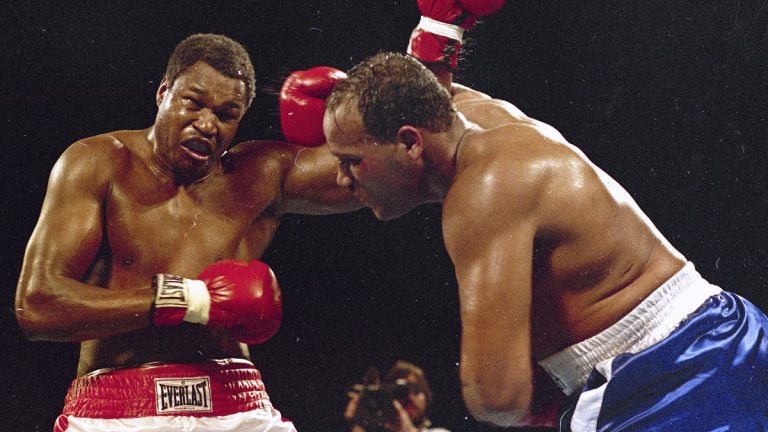 In March 1985, Larry Holmes, left, battles David Bey during a bout in Las Vegas. Bey, a former heavyweight boxing champ from Philadelphia nicknamed 