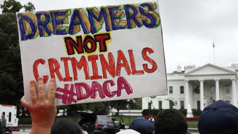  In this Aug. 15, 2017 a woman holds up a signs in support of the Obama administration program known as Deferred Action for Childhood Arrivals, or DACA, during an immigration reform rally at the White House in Washington. After months of delays, President Donald Trump is expected to decide soon on the fate of so called 'dreamers' who were brought into the country illegally as children as he faces a looming court deadline and is digging in on appeals to his base. (Jacquelyn Martin/AP Photo, File) 