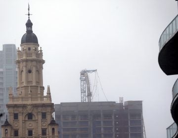  A crane atop a building under construction in downtown, center, collapsed as Hurricane Irma passed by, Sunday, Sept. 10, 2017, in Miami. The crane collapsed in a bayfront area filled with hotels and high-rise condo and office buildings, near AmericanAirlines Arena, according to a tweet from the City of Miami. (Wilfredo Lee/AP Photo) 