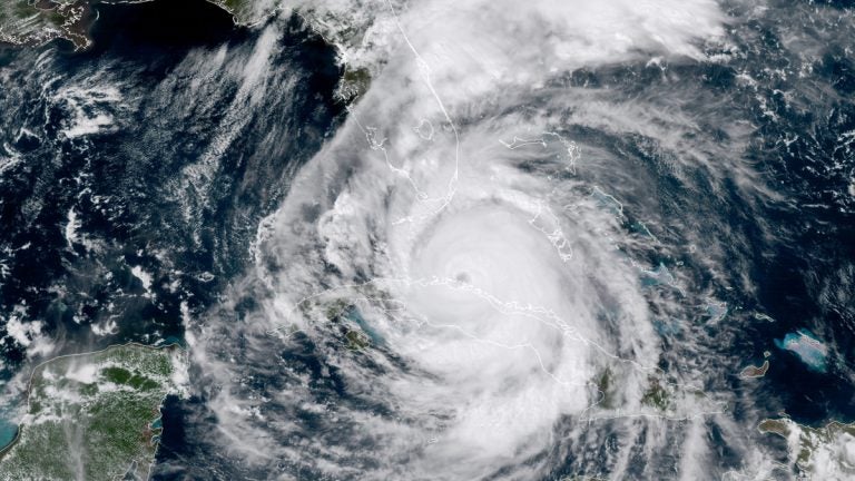  In this geocolor GOES-16 satellite image taken Saturday, Sept. 9, 2017, at 18:30 UTC (2:30 p.m. EDT), the eye of Hurricane Irma moves northwest just off the coast of Cuba and south of Florida. (NOAA via AP) 