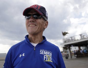  In a photo taken Thursday, Sept. 14, 2017, Frank Costello, organizer of the Semper Five charity run in Seaside Heights, N.J., poses for The Associated Press at the site of the start and finish lines for the race. (Julio Cortez/AP Photo) 