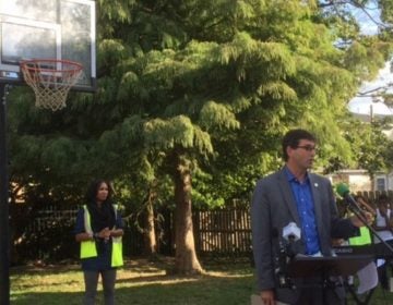 New Castle County Executive Matt Meyer talks about a new basketball hoop paid for by the county to replace one that was damaged by vandals. It's part of an effort to keep kids in the neighborhood out of trouble. (Zoë Read/WHYY)