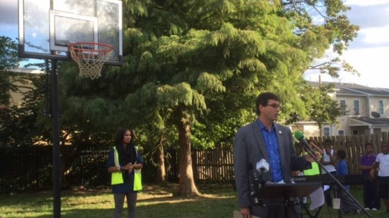 New Castle County Executive Matt Meyer talks about a new basketball hoop paid for by the county to replace one that was damaged by vandals. It's part of an effort to keep kids in the neighborhood out of trouble. (Zoë Read/WHYY)