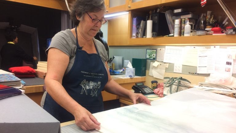  Mindell Dubansky has been repairing books at the Met for 35 years. (Alan Yu/WHYY) 