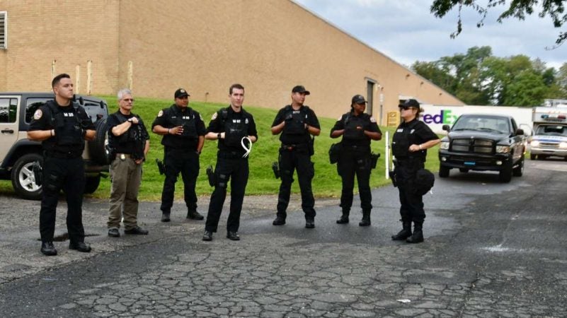 Police officers are posted outside the FOP in Northeast Philadelphia as members of the local law enforcement community hold a rally on Thursday. (Bastiaan Slabbers for NewsWorks)