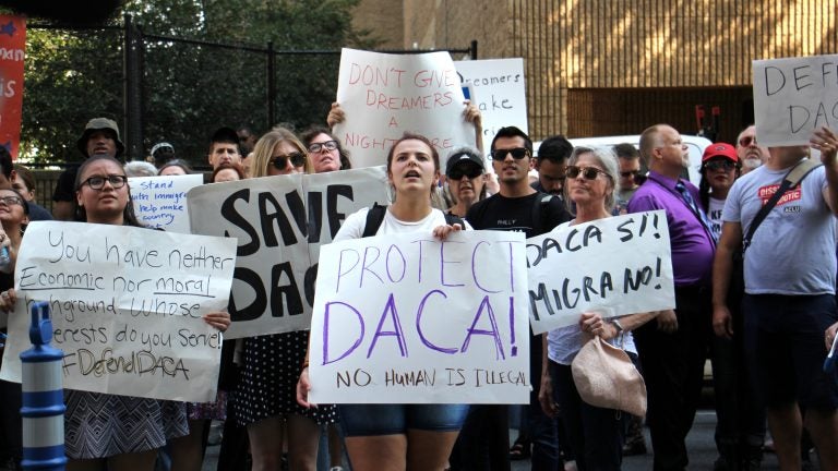 Protesters march in Philadelphia to demand protection for  immigrants who arrived in the U.S. illegally as children and have been given a path to citizenship through DACA (Deferred Action for Childhood Arrivals). (Emma Lee/WHYY)  