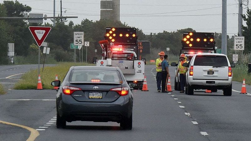 DelDOT trucks block access to southbound Rt. 1 near Dewey Beach after a dune breached allowed ocean water to cover the highway Tuesday morning.