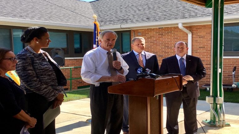 U.S. Sens. Chris Coons and Tom Carper spoke out against the latest GOP health care bill at a press conference outside the VA Medical Center in Wilmington. (Zoë Read/WHYY)