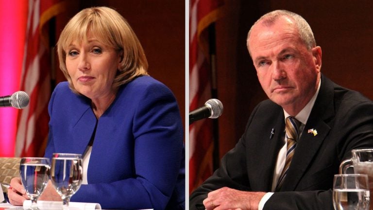 Two candidates, both seated at table, with microphone; Guadagno in blue suit (left) Murphy in black (right)