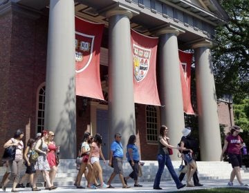  A tour group is shown walking through the campus of Harvard University in Cambridge, Mass. Word of an August 2017 Justice Department inquiry into how race factors into admissions at Harvard University has left top-tier colleges bracing for scrutiny of practices that have boosted diversity levels to new highs. (AP Photo/Elise Amendola, File)  