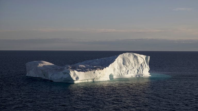 An iceberg floats in Baffin Bay in the Canadian Arctic Archipelago, Tuesday, July 25, 2017. The iceberg calved off a glacier from the Greenland ice sheet, the second largest body of ice in the world which covers roughly 80 percent of the country. (David Goldman/AP Photo)