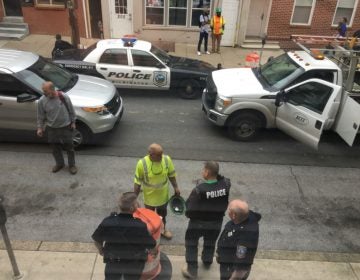  Police investigate a shooting on 7th St. in May. A 13-year-old boy was arrested after a brief chase. (Mark Eichmann/WHYY) 