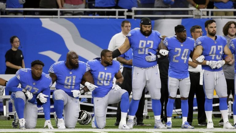 Detroit Lions players take a knee during the national anthem before an NFL football game against the Atlanta Falcons, Sunday, Sept. 24, 2017, in Detroit.